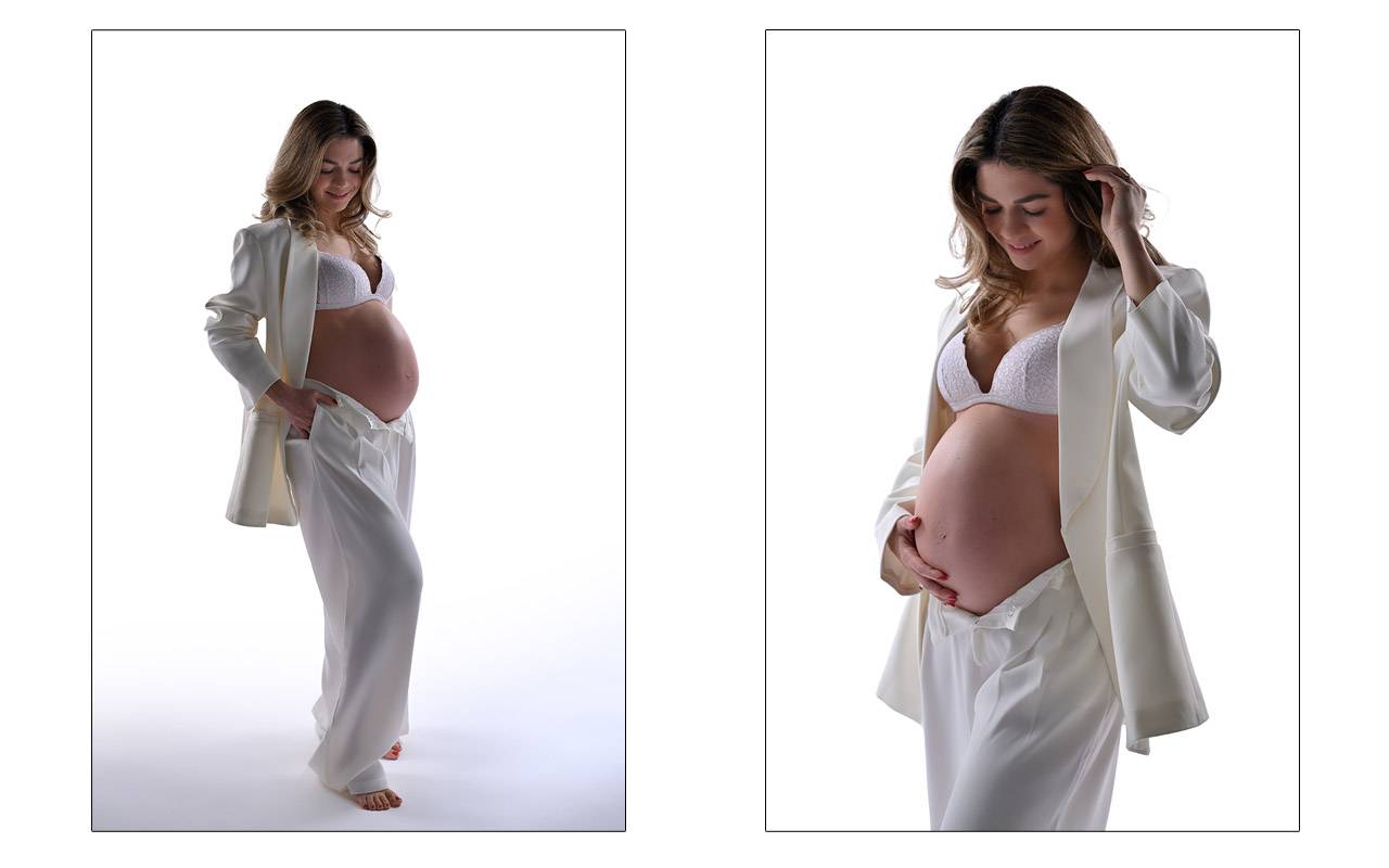 Donna in gravidanza fotografata con abiti bianchi in studio